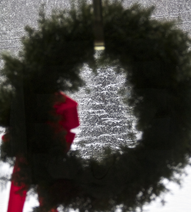 Looking out at the afternoon snow through the front door