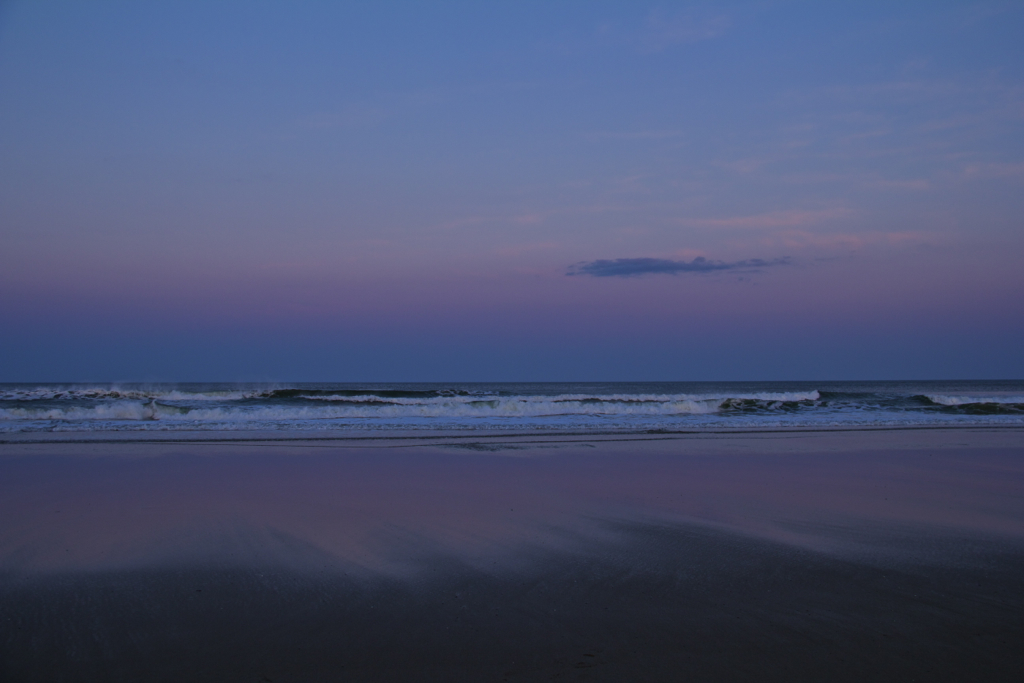 The beach putting on a display of Lenten penance purple on Easter Eve.